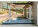 A charming backyard pergola with a serene pond, lush landscaping, and a cozy outdoor space at 356 Ivy Glen Cir, Avondale Estates, GA 30002
