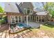 An elevated view of the property showcasing a water feature, patio, and outdoor living spaces at 356 Ivy Glen Cir, Avondale Estates, GA 30002