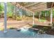 Landscaped backyard with a charming pergola, a serene water feature, and lush greenery at 356 Ivy Glen Cir, Avondale Estates, GA 30002