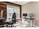 Bedroom with black desks, gaming chairs, and large windows overlooking a fenced backyard at 356 Ivy Glen Cir, Avondale Estates, GA 30002