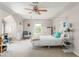 Bright bedroom with a four-poster bed, sitting area, large window, and neutral decor at 356 Ivy Glen Cir, Avondale Estates, GA 30002