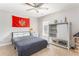 Cozy bedroom featuring a queen bed, ceiling fan, and a rustic sliding door wardrobe at 356 Ivy Glen Cir, Avondale Estates, GA 30002
