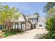 Charming two-story home with gray siding, manicured lawn, and attached two-car garage on a sunny day at 356 Ivy Glen Cir, Avondale Estates, GA 30002