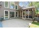 Exterior of home with a screened porch, large windows, and a patio area for entertaining at 356 Ivy Glen Cir, Avondale Estates, GA 30002