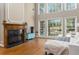 The living room fireplace is a focal point, flanked by large windows for natural light at 356 Ivy Glen Cir, Avondale Estates, GA 30002