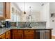 Kitchen featuring granite counters, wooden cabinets, stainless steel appliances and an undermount sink at 356 Ivy Glen Cir, Avondale Estates, GA 30002