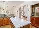 Gourmet kitchen features granite countertops, stainless steel appliances, and an open view to the living area at 356 Ivy Glen Cir, Avondale Estates, GA 30002