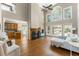 The grand living room boasts two story windows, a fireplace and ample comfortable seating at 356 Ivy Glen Cir, Avondale Estates, GA 30002