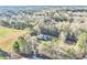 Secluded home nestled among mature trees, set back from a quiet country road at 8445 Vernon Grove Rd, Chattahoochee Hills, GA 30268