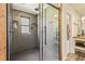 Modern bathroom with walk-in shower and wood accents at 8445 Vernon Grove Rd, Chattahoochee Hills, GA 30268