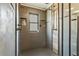 Contemporary shower with black hardware and decorative niche at 8445 Vernon Grove Rd, Chattahoochee Hills, GA 30268