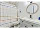 Bathroom featuring a modern sink and vanity, toilet and decorative shower curtain at 8445 Vernon Grove Rd, Chattahoochee Hills, GA 30268