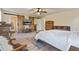 Spacious main bedroom features wood floors, sliding barn doors and ensuite bathroom at 8445 Vernon Grove Rd, Chattahoochee Hills, GA 30268