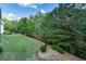 Spacious backyard with lush greenery and mature trees for privacy at 110 Mountain Laurel Ct, Canton, GA 30114