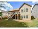 Back exterior featuring a deck, stairs and grassy lawn at 110 Mountain Laurel Ct, Canton, GA 30114