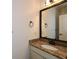 Bathroom featuring granite countertop, undermount sink, and updated fixtures at 110 Mountain Laurel Ct, Canton, GA 30114