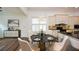 Bright dining area features an elegant table with marble top, and a decorative chandelier, adjacent to the kitchen at 110 Mountain Laurel Ct, Canton, GA 30114