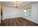Empty dining room with hardwood floors and white walls at 110 Mountain Laurel Ct, Canton, GA 30114