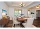 A formal dining room features stylish decor, coffered ceilings, and ample natural light at 110 Mountain Laurel Ct, Canton, GA 30114