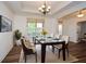 A formal dining room boasts hardwood floors, stylish decor, and plenty of space for entertaining at 110 Mountain Laurel Ct, Canton, GA 30114