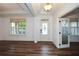 Elegant foyer with hardwood floors, decorative trim, and a stylish front door at 110 Mountain Laurel Ct, Canton, GA 30114