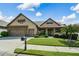 Charming home featuring a manicured lawn, two-car garage, and classic architectural details at 110 Mountain Laurel Ct, Canton, GA 30114