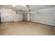 Spacious three car garage with epoxy floors and white cabinets for storage at 110 Mountain Laurel Ct, Canton, GA 30114