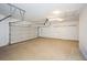 Clean and spacious two car garage with finished epoxy flooring at 110 Mountain Laurel Ct, Canton, GA 30114
