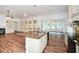 Open kitchen featuring a center island, hardwood floors, and granite countertops at 110 Mountain Laurel Ct, Canton, GA 30114