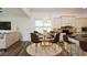 A charming kitchen nook features hardwood floors, a modern chandelier, and an eat-in area at 110 Mountain Laurel Ct, Canton, GA 30114