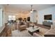 Spacious living room with a view of the modern kitchen and dining area at 110 Mountain Laurel Ct, Canton, GA 30114