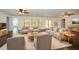 Spacious living room with neutral tones, hardwood flooring, and large windows for natural light at 110 Mountain Laurel Ct, Canton, GA 30114