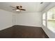 Spacious living room with hardwood floors, multiple windows, and neutral colors for a modern design at 110 Mountain Laurel Ct, Canton, GA 30114
