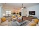 An open-concept living room features modern decor, hardwood floors, and abundant natural light at 110 Mountain Laurel Ct, Canton, GA 30114