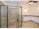 Large bathroom boasts a seamless glass shower and dual vanities at 110 Mountain Laurel Ct, Canton, GA 30114