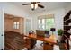 Bright office with a large wood desk, shelving and beautiful views at 110 Mountain Laurel Ct, Canton, GA 30114