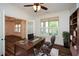 Office featuring a wood desk, hardwood floors, and natural light at 110 Mountain Laurel Ct, Canton, GA 30114