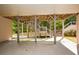 Covered outdoor patio area with view of stairs and backyard at 110 Mountain Laurel Ct, Canton, GA 30114