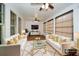 A bright and airy sunroom offers comfortable seating and neutral decor at 110 Mountain Laurel Ct, Canton, GA 30114