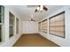 Bright sunroom with windows, ceiling fans, and wall-to-wall carpeting at 110 Mountain Laurel Ct, Canton, GA 30114