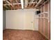 An unfinished basement area with tiled floors, shelving and access to utilities at 110 Mountain Laurel Ct, Canton, GA 30114