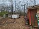 Backyard view, showing the house and a variety of items in the yard at 111 Oak Grove Rd, Temple, GA 30179