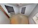 Cozy bedroom featuring neutral-colored walls, window, and an air conditioner, defurnished using Matterport AI at 111 Oak Grove Rd, Temple, GA 30179