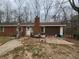 Exterior front of a brick house with a garage and covered front porch at 111 Oak Grove Rd, Temple, GA 30179