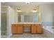 Bright bathroom features double vanity, soaking tub, and a separate shower at 2782 Laurel Valley Trl, Buford, GA 30519