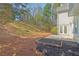 A well maintained backyard with lush greenery and a garden box at 6230 Hampton Highlands Dr, Cumming, GA 30041