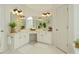 A spacious white bathroom features a double sink vanity, white cabinets, and lots of counter space at 6230 Hampton Highlands Dr, Cumming, GA 30041