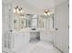 A spacious white bathroom features a double sink vanity, white cabinets, and lots of counter space at 6230 Hampton Highlands Dr, Cumming, GA 30041