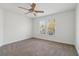 A large empty bedroom features neutral carpet and a ceiling fan at 6230 Hampton Highlands Dr, Cumming, GA 30041