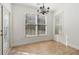 Bright dining area with large windows and a modern chandelier at 6230 Hampton Highlands Dr, Cumming, GA 30041